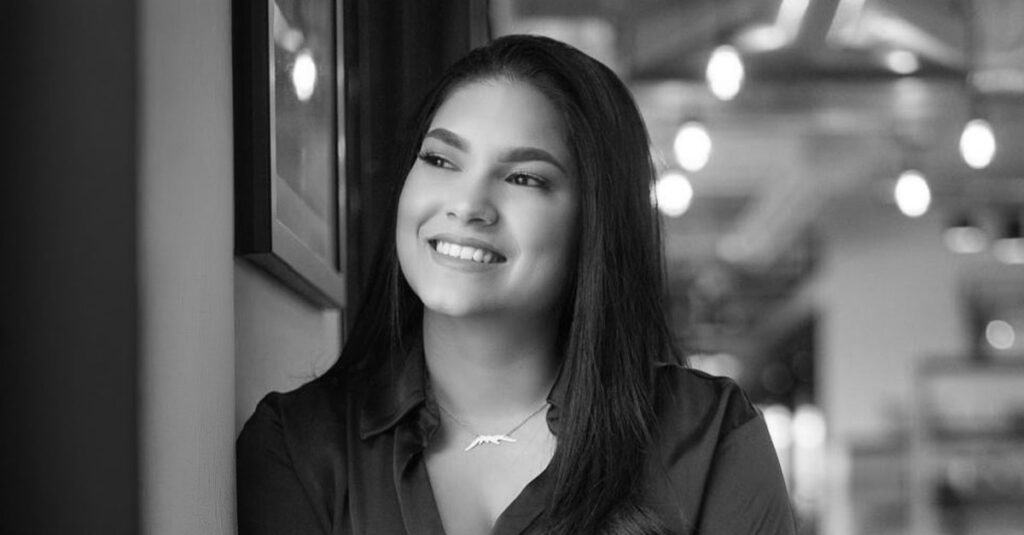 A match lighting a candle, reflecting Vanessa's Why of curiosity sparked by inspiring people